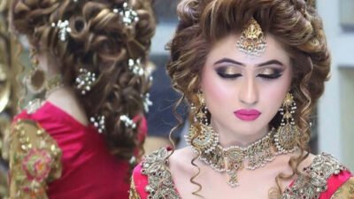 Download A Beautiful Bride In Red Bridal Wear | Wallpapers.com